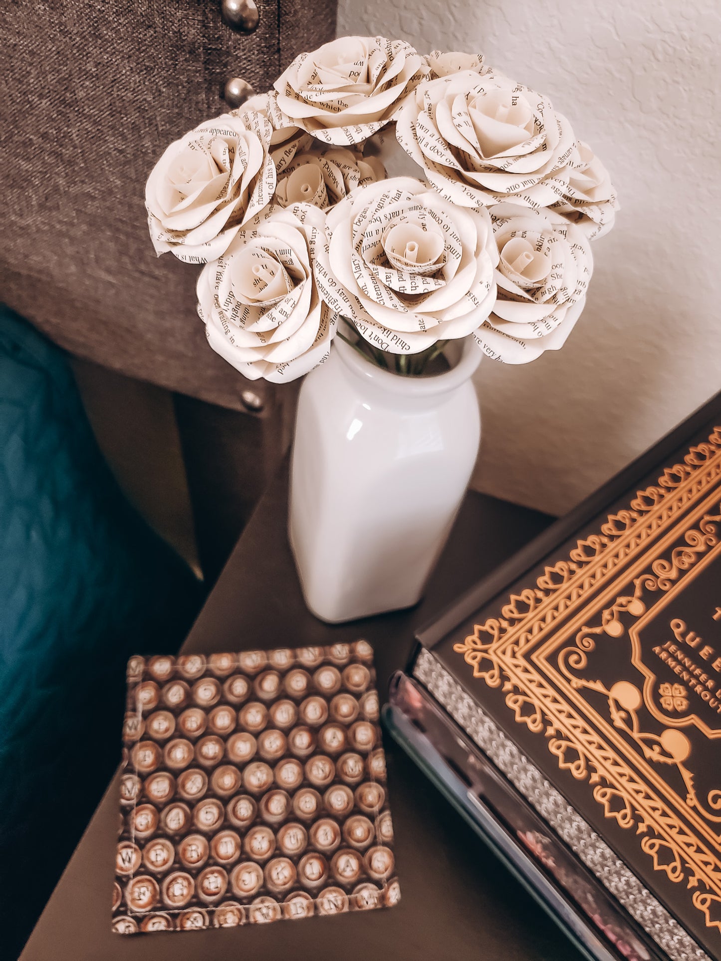 book page paper rose flower bouquet siting on a nightstand next to books - Novel Blossoms Co