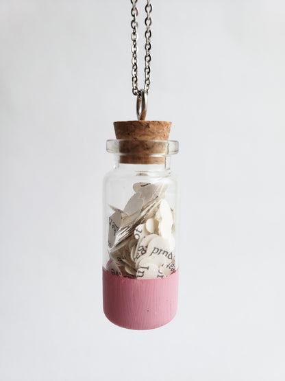 A small jar necklace with heart cut outs of book pages inside - Novel Blossoms Co