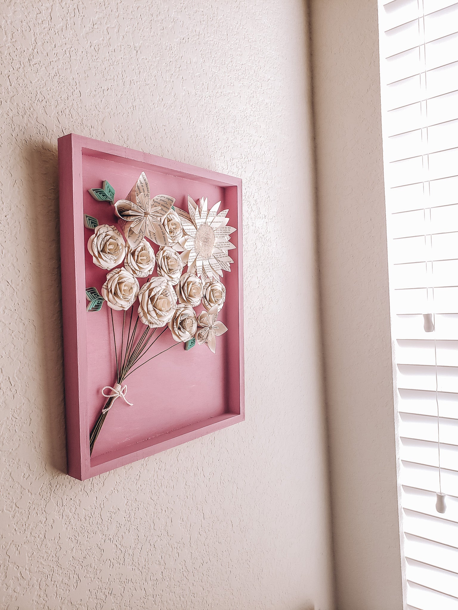 Framed art piece of book page paper flowers in the shape of a bouquet - Novel Blossoms Co