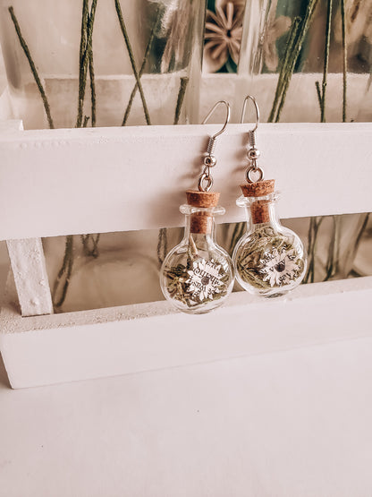 paper book page flowers in tiny glass jar earrings hanging on a white wood crate - Novel Blossoms Co